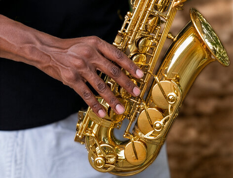close up of a saxophone in the hands being played