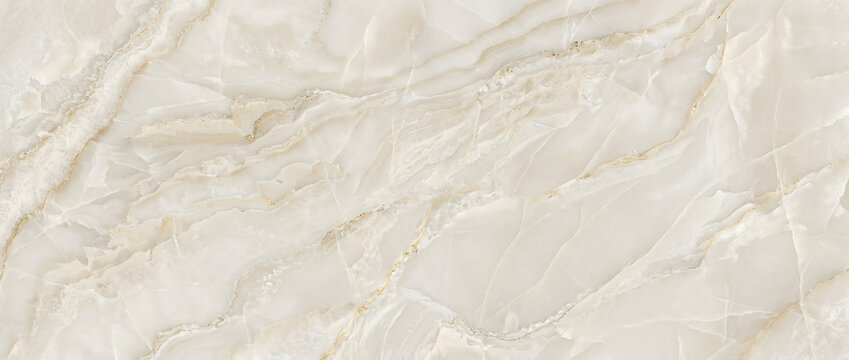 Marble texture background with subtle gold veins layered across a warm ivory onyx stone surface