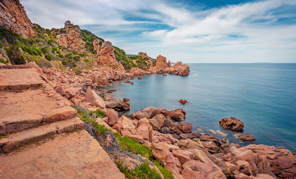 Picturesque morning view of torist payh to Li Cossi beach. Rocky summer scene of Costa Paradiso, Sardinia island, Italy, Europe. Spectacular Mediterranean seascape. 