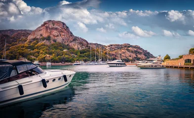 Attractive summer view of Poltu Quatu port with luxury yacht and motorboat. Amazing morning scene of Sardinia island, Italy, Europe. Picturesque Mediterranean seascape. Traveling concept background. © Andrew Mayovskyy
