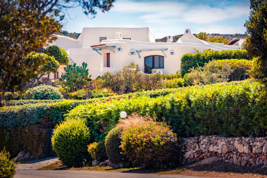 Сharm of the ancient cities of Europe. Marvelous afternoon view of Rafael resirt with mediterranean style architecture. Superb summer scene of Sardinia island, Palau Province of Olbia-Tempio, Italy.