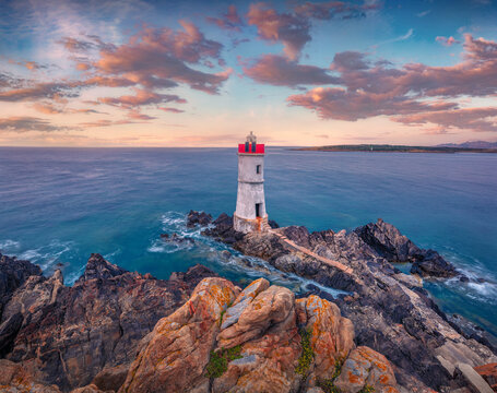 Beautiful marine scenery. Picturesque morning view of di Capo Ferro Lighthose. Amazing summer scene of Sardinia island, Italy, Europe. Splendid  Mediterranean seascape.