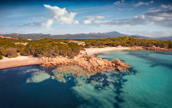 Astonishing summer View from flying drone of popular touris deastination - Capriccioli beach, Costa Smeralda. Exciting morning scene of Sardinia, Italy, Europe. Beauty of nature concept background.