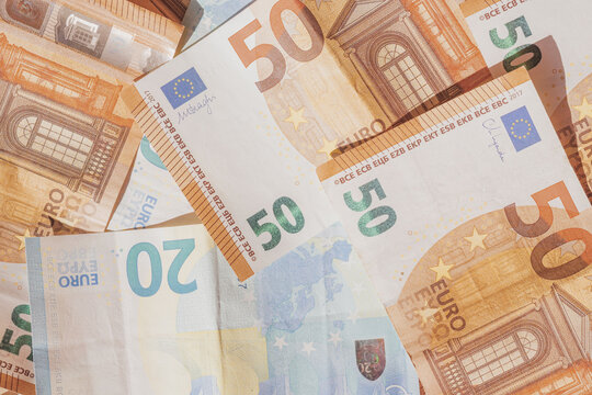 Twenty and fifty euro banknotes as flat lay pattern. Top view photo European paper money