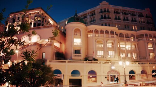 Hotel de paris monte carlo exterior facade view at dusk in monaco.