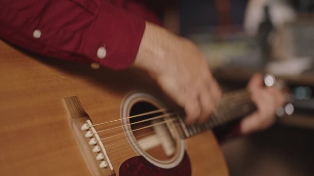 Close-Up of Strumming Hand on Martin Acoustic Guitar