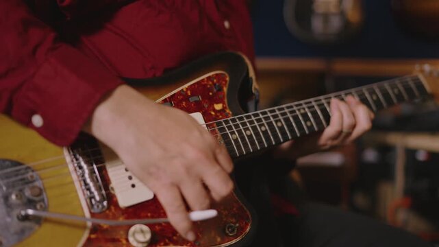 Hands on offset guitar &mdash; Whammy Bar and Picking, Body Close-Up