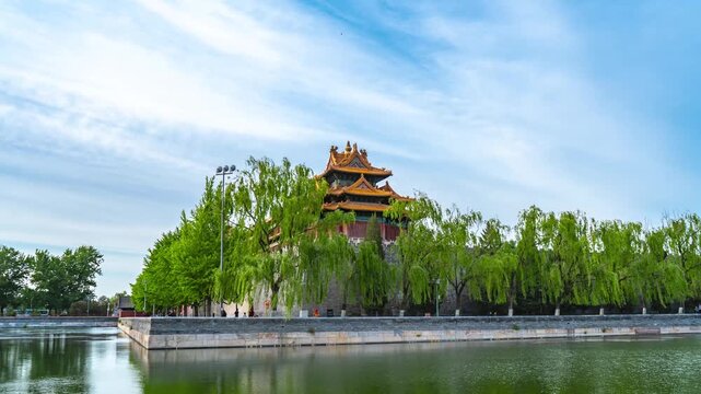Forbidden City watchtower and moat with willow trees in Beijing in Forbidden City, Beijing, China