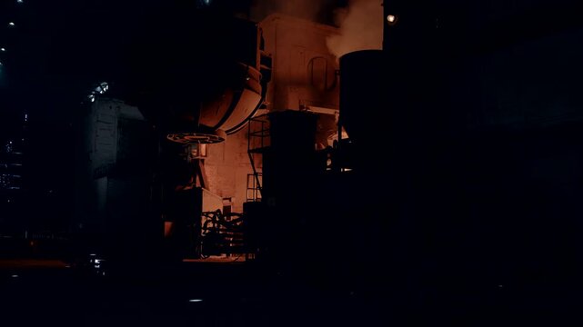 Dark Foundry Interior with Furnace Glow and Heavy Industrial Machinery