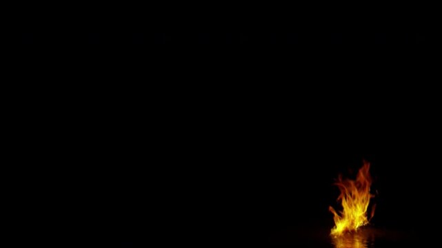 Dynamic fire flames burning on black background.
