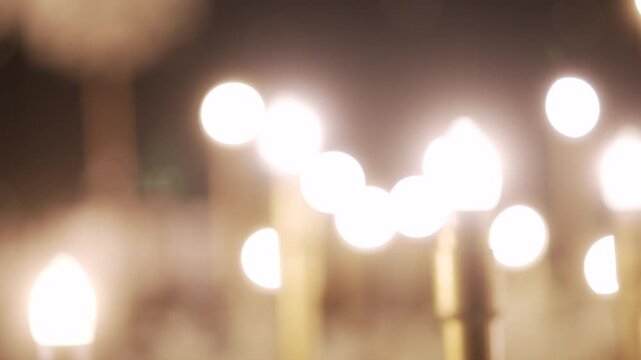 The blurred decorative lights create a beautiful visual effect, giving an artistic touch to the video.