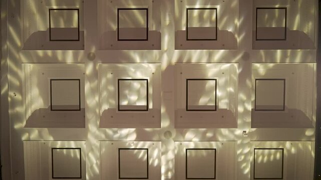 The light from the ceiling of the ballroom is clearly visible, emitting an elegant light and perfectly illuminating the entire room.