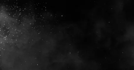Realistic snowstorm particles and drifting snowflakes isolated on black background. Atmospheric winter weather effect ideal for overlays, visual effects, compositing and cinematic scenes. © Jag_cz