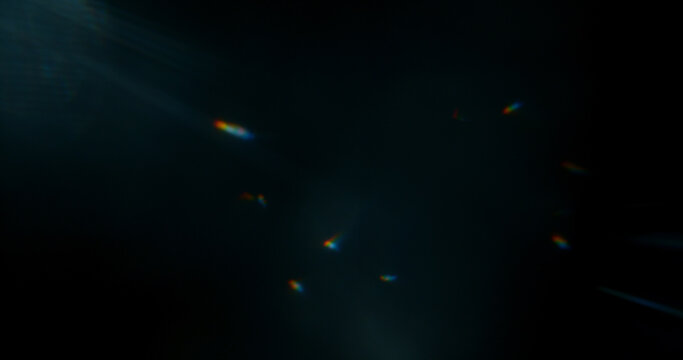 Abstract cinematic lens flare with soft bokeh circles and subtle light reflections. Atmospheric optical effect background ideal for overlays, visual effects, film production and creative design.