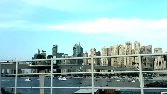Dubai, UAE. April 25, 2026. View of the JBR area and the beautiful bustling creek with yachts and boats. Dubai city. High quality FullHD footage