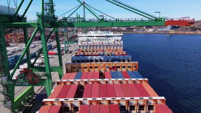 Marvel at the dynamic container port in Nova Scotia, where colorful cargo containers line the waterfront and cranes orchestrate the flow of goods with precision