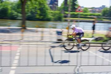 Fototapeta premium Cyclist in sportswear and sport helmet riding road bike isolated on free png background. Concept of sport, triathlon, competition, tournament, championship and speed.