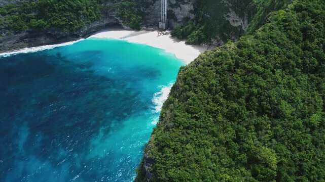 Aerial drone view of tropical sea stack and turquoise ocean in Nusa Penida Bali Indonesia