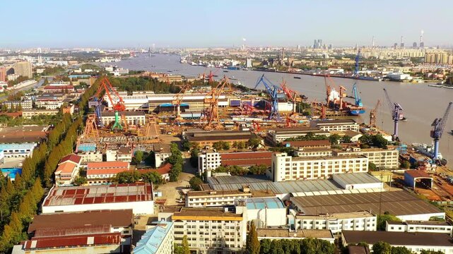 Aerial view of shipyard and cranes along the Huangpu River in Shanghai China