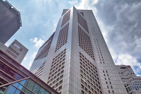 SINGAPORE CITY, SINGAPORE - MARCH 13, 2024: One Raffles Place, a landmark office building in Downtown Core district of Singapore City. It was designed by Kenzo Tange Associates.