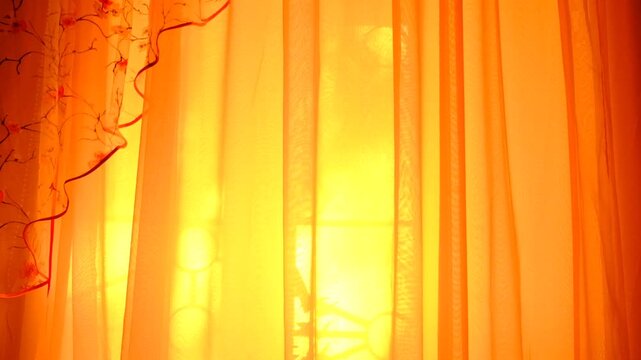 Summer solstice bathes the room in a magical light. Soft rays of sunlight stream through a sheer, transparent curtain, diffusing into a warm, golden glow that fills the cozy bedroom. Atmospheric mood
