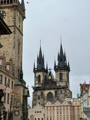 Fototapeta premium Historic architecture of Prague Old Town, Czech Republic. Beautiful European cityscape with traditional buildings, cobblestone streets and famous landmarks under a clear sky.