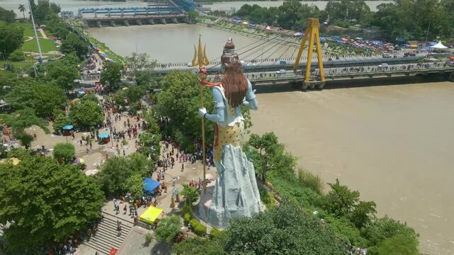 The majestic aerial view captures Haridwar's core: the sacred Har Ki Pauri ghat on the Ganges, the colossal Lord Shiva Statue, and the hilltop Mansa Devi Temple