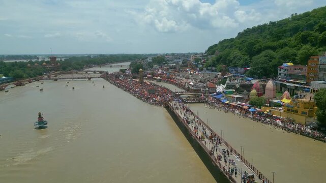 The majestic aerial view captures Haridwar's core: the sacred Har Ki Pauri ghat on the Ganges, the colossal Lord Shiva Statue, and the hilltop Mansa Devi Temple