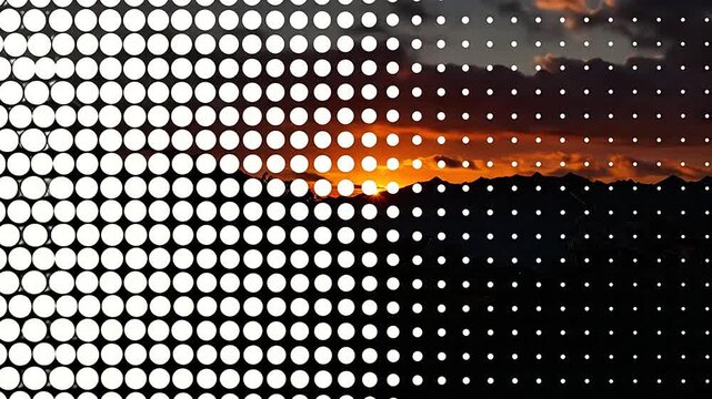 A vibrant sunset view is partially obscured by a digital white dot pattern overlay