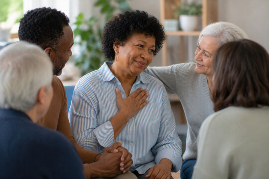Warm group embraces inside cozy living room
