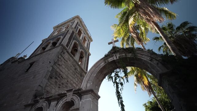 Visit Loreto Mission in Baja California Sur as the sun sets over the desert, showcasing its rich history and unique architecture