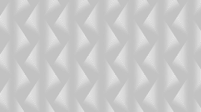 An abstract geometric pattern of repeating triangles with gradation of white lines on a light gray background. 