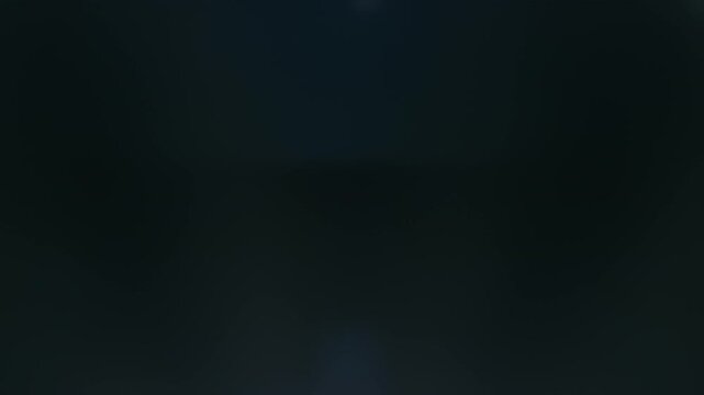 Real Shooted Lens Flare Transitions on Black Background in Slow Motion.