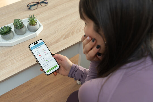 Woman booking medical appointment using digital health app