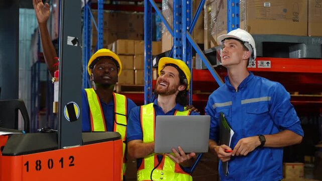 Worker discuss in warehouse using laptop in conversation. Safety inspection,Training employee for logistic employee in warehouse. Digital technology, Team meeting and supply chain with manager 