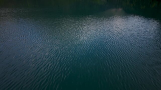 Lake reflections show clouds and reveal Pic du Midi d'Ossau in the French Pyr&eacute;n&eacute;es landscape. Enjoy nature and mountains