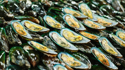 Closeup of fresh green mussels displayed for sale at seafood market in Thailand © Pavel