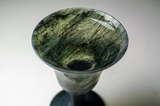 Two vintage translucent jadeite 'Moonlight Cups' on a white background.