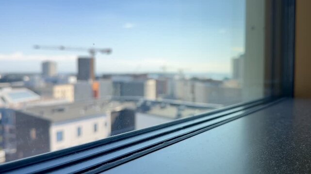 Blurred Window View of Urban Development and Construction in J&auml;tk&auml;saari