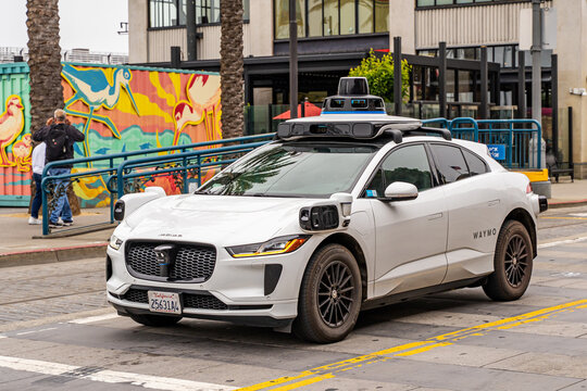 Waymo self-driving car operating on city streets in San Francisco