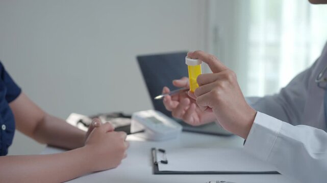 Medical professional in a white coat holding a pill bottle, talking to a patient about dosage and treatment during a consultation