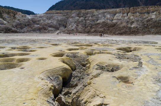 Volcanic Crater Floor with Sulfur Formations and Visitors on Nisyros Greece