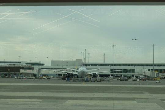 Richmond, BC, Canada - June 13, 2023: A Boeing 777 aircraft operated by Air Canada is seen parked at a terminal gate at Vancouver International Airport (YVR) in Richmond, British Columbia.