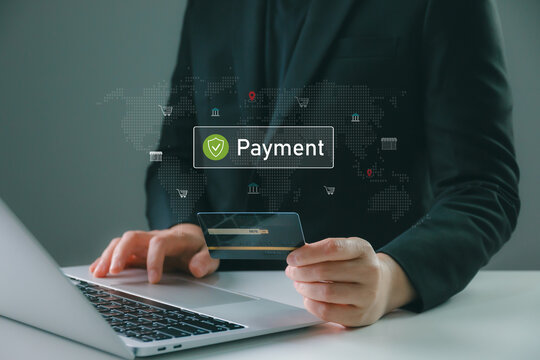 Business professional making secure online payment with credit card on laptop, digital banking interface with global network map, fintech technology, e commerce security, financial transaction concept