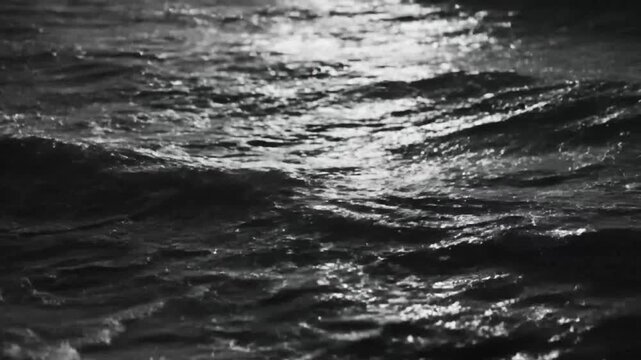 Turbulent dark ocean wave breaking at night with dramatic light