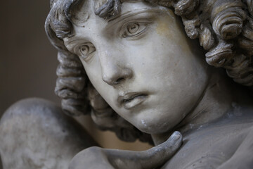 Fototapeta premium Guardian angel statue in antique cemetery.