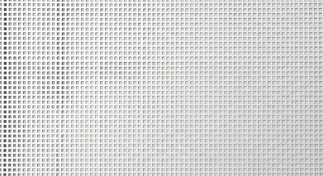 Closeup of a white perforated metal sheet with a square grid pattern