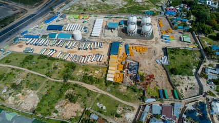 Fototapeta premium Aerial view of gas facility in Dar es Salaam showcasing industrial energy infrastructure storage tanks and modern fuel distribution operations in Tanzania