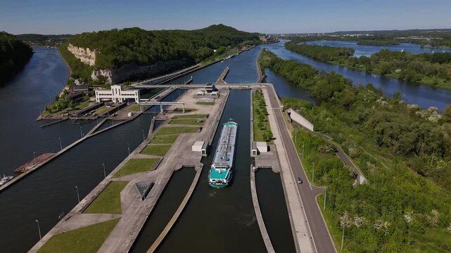Barge enters the lock at Ecluse de Lanaye on the Albert Canal near the Maas River border in Belgium