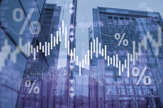 Stock market data and financial charts overlaying modern office skyscrapers in a business district